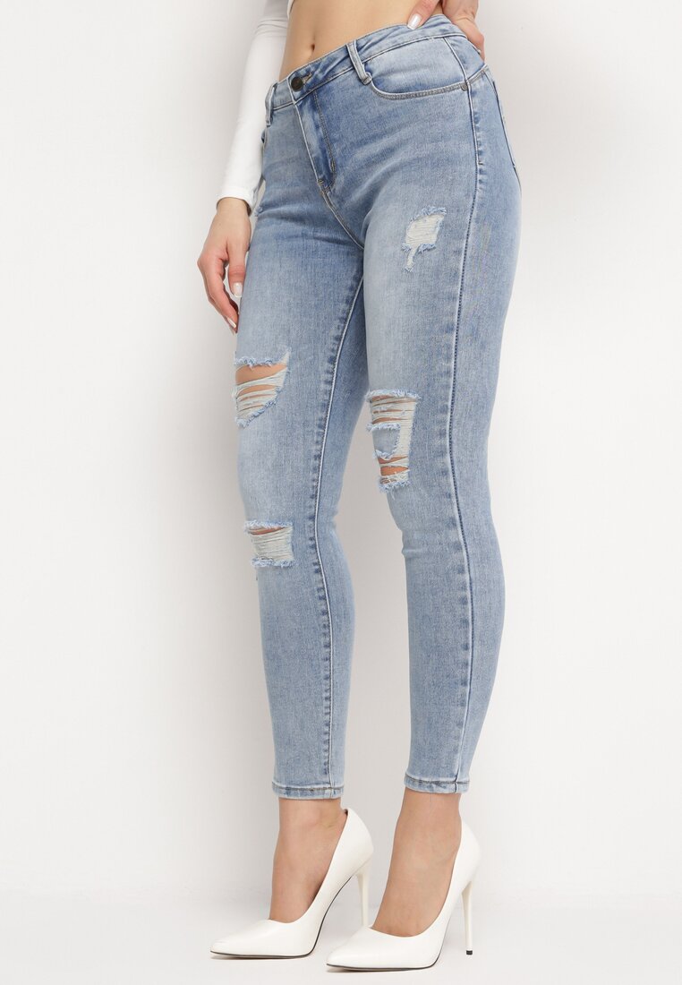Jean skinny bleu avec trous et effet push up