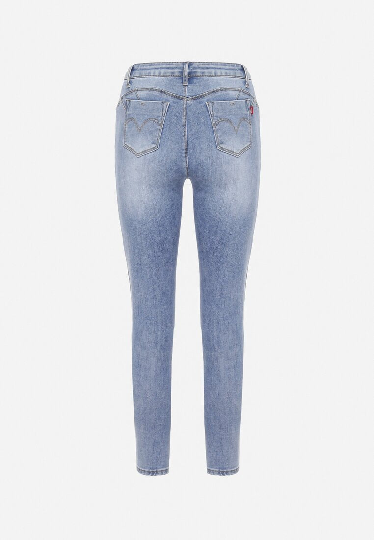 Jean skinny bleu avec trous et effet push up